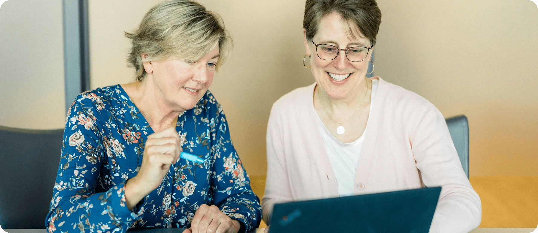 Two colleagues collaborating on a laptop during a meeting in Lewisville, NC – Birch Stream Digital